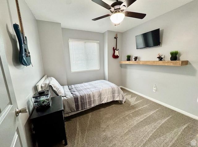 carpeted bedroom featuring a ceiling fan and baseboards