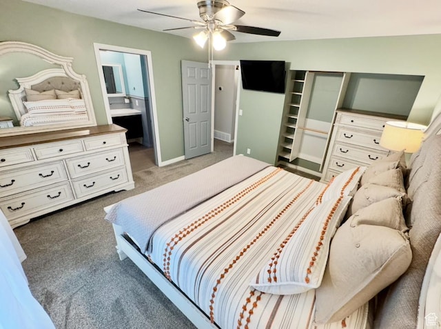 bedroom featuring carpet floors, a ceiling fan, baseboards, and connected bathroom