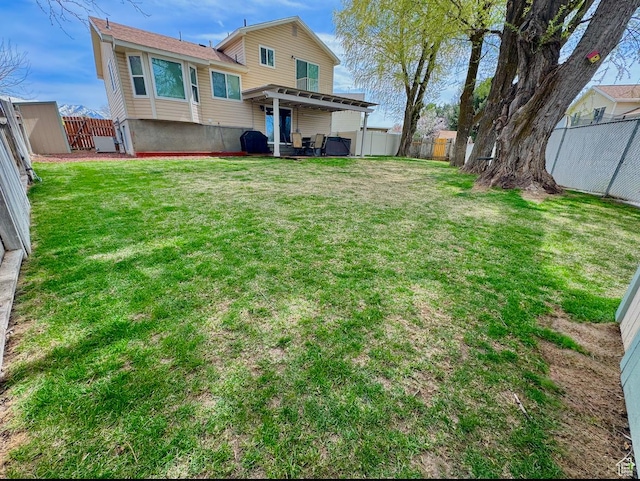 view of yard with a fenced backyard