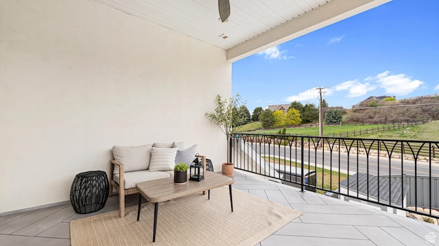 balcony featuring ceiling fan