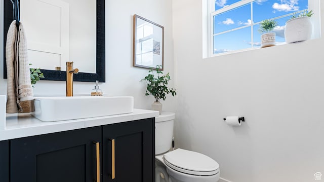 half bath with toilet and vanity