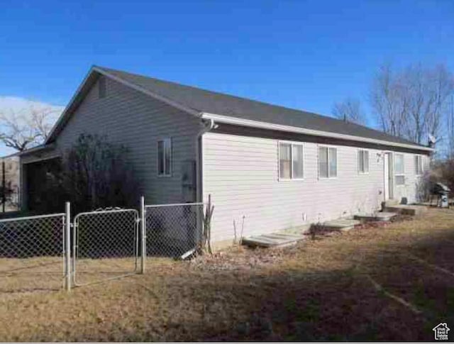 view of property exterior with a gate
