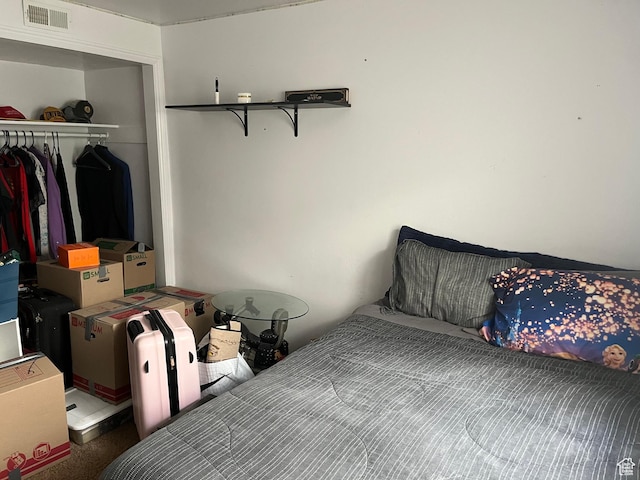 bedroom featuring a closet and visible vents