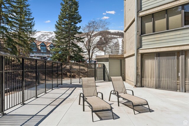 1485 S Empire Ave Unit 216, Park City, UT 84060 - snow covered patio featuring fence and a mountain view