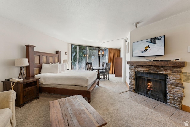 1485 S Empire Ave Unit 216, Park City, UT 84060 - bedroom with a fireplace, expansive windows, and carpet