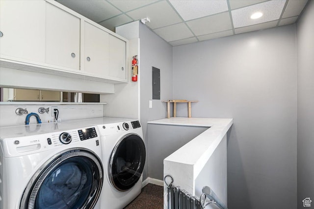 clothes washing area with washing machine and dryer, electric panel, carpet, and cabinet space