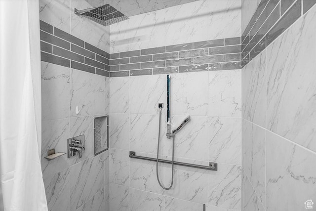 full bath featuring tiled shower