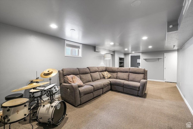 living area with recessed lighting, light carpet, and baseboards