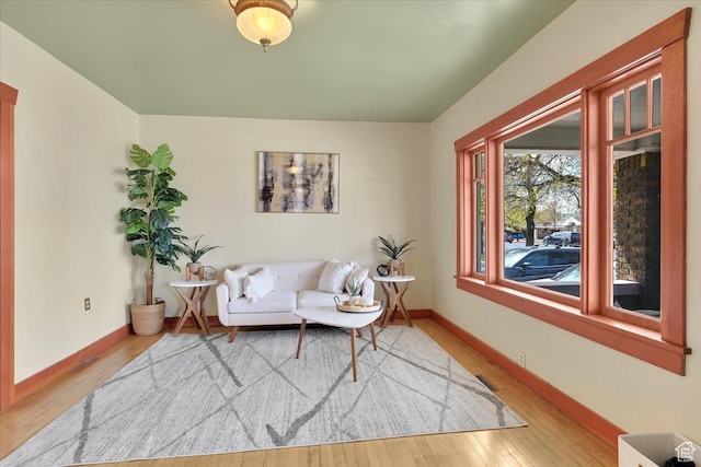 living room featuring hardwood / wood-style floors and baseboards