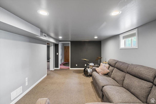 carpeted living room featuring baseboards, visible vents, and recessed lighting