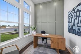home office with wood finished floors and baseboards