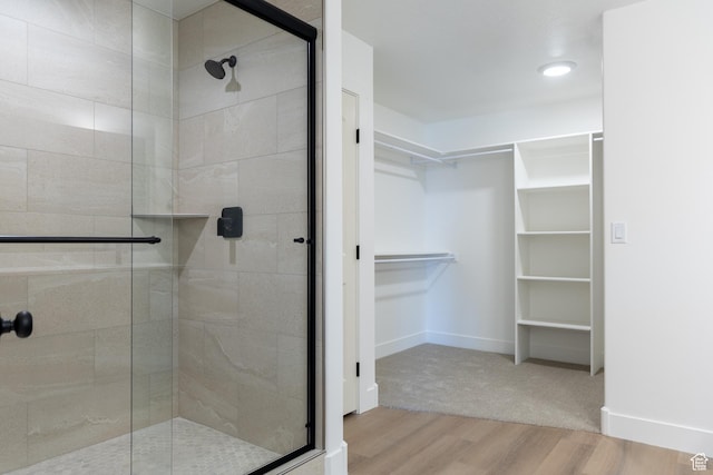 1403 E 1230 S Unit 45, Garland, UT 84312 - full bath with a shower stall, baseboards, wood finished floors, and a spacious closet