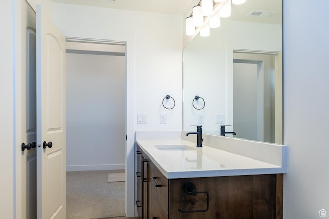 1403 E 1230 S Unit 45, Garland, UT 84312 - bathroom featuring baseboards, visible vents, and vanity