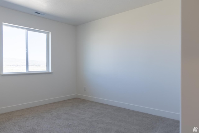 1403 E 1230 S Unit 45, Garland, UT 84312 - empty room featuring visible vents, baseboards, and light carpet