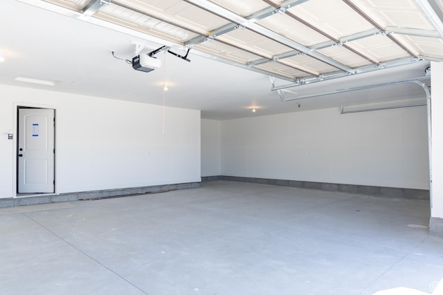 1403 E 1230 S Unit 45, Garland, UT 84312 - garage featuring baseboards and a garage door opener