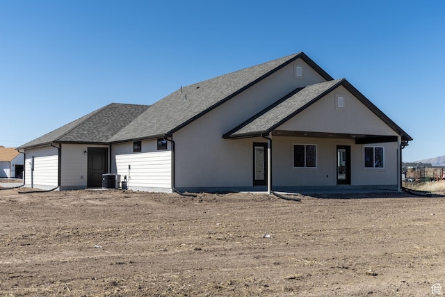 1403 E 1230 S Unit 45, Garland, UT 84312 - rear view of house with a shingled roof and central AC