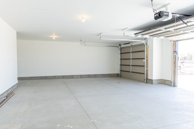 1403 E 1230 S Unit 45, Garland, UT 84312 - garage featuring baseboards and a garage door opener