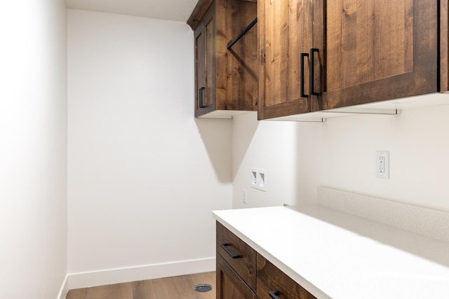 1403 E 1230 S Unit 45, Garland, UT 84312 - washroom with cabinet space, washer hookup, baseboards, and light wood-type flooring