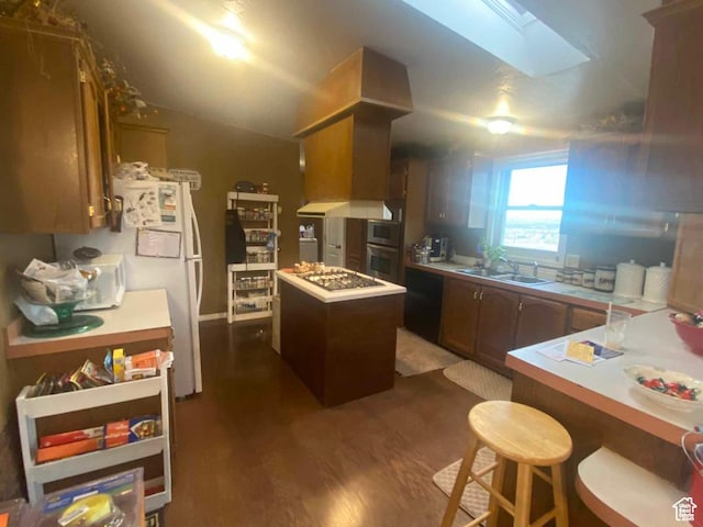 5141 W 940 S, Roosevelt, UT 84066 - kitchen with a sink, a skylight, light countertops, dark wood-type flooring, and a kitchen island