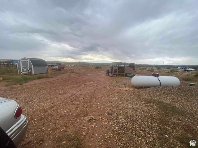 5141 W 940 S, Roosevelt, UT 84066 - view of yard featuring a storage shed, fence, and an outdoor structure