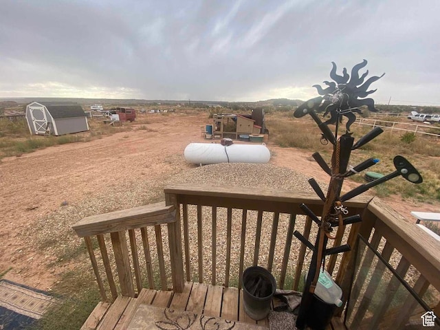 5141 W 940 S, Roosevelt, UT 84066 - wooden terrace featuring an outbuilding and a shed
