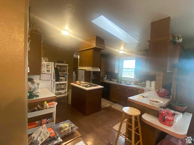 5141 W 940 S, Roosevelt, UT 84066 - kitchen featuring light countertops, a kitchen island, dark wood-style floors, and a sink
