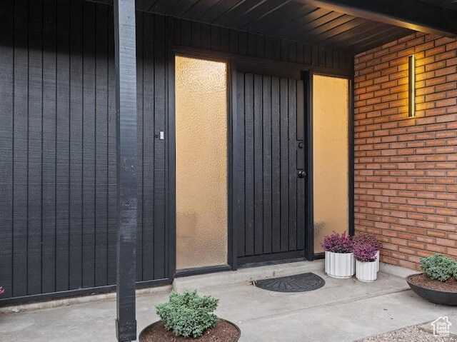 976 E Hyland Lake Dr, Murray, UT 84121 - doorway to property with brick siding