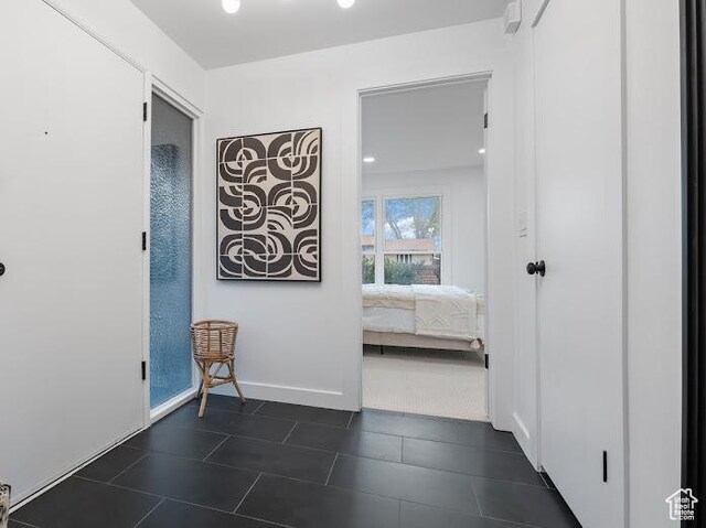 976 E Hyland Lake Dr, Murray, UT 84121 - hall with baseboards and dark tile patterned flooring