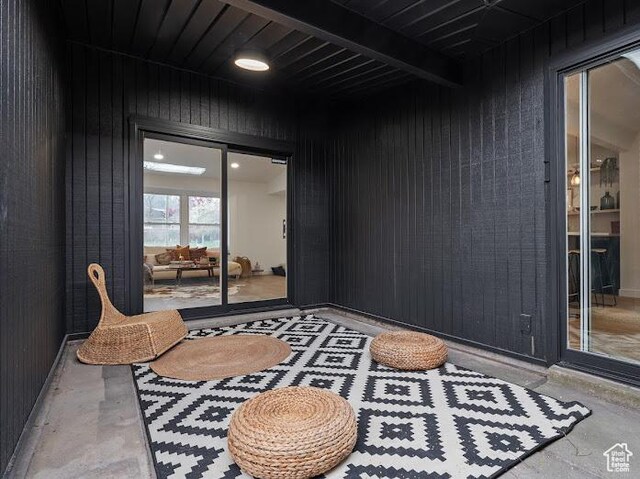 976 E Hyland Lake Dr, Murray, UT 84121 - living area with concrete flooring and wooden walls