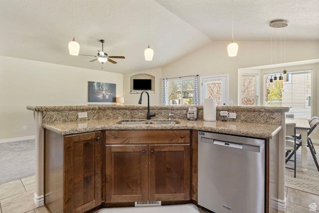 kitchen featuring stainless steel dishwasher, a ceiling fan, light stone counters, a sink, and lofted ceiling