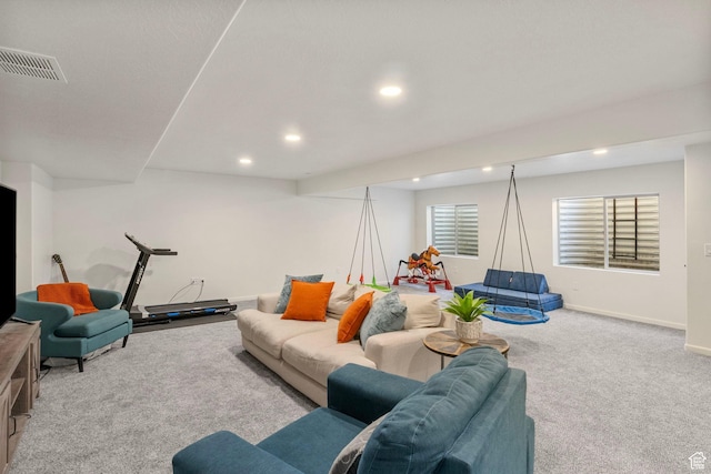 living area featuring recessed lighting, carpet, visible vents, and baseboards