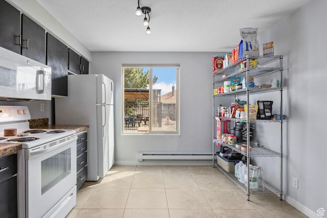 kitchen with dark cabinets, white appliances, light tile patterned flooring, a textured ceiling, and baseboard heating