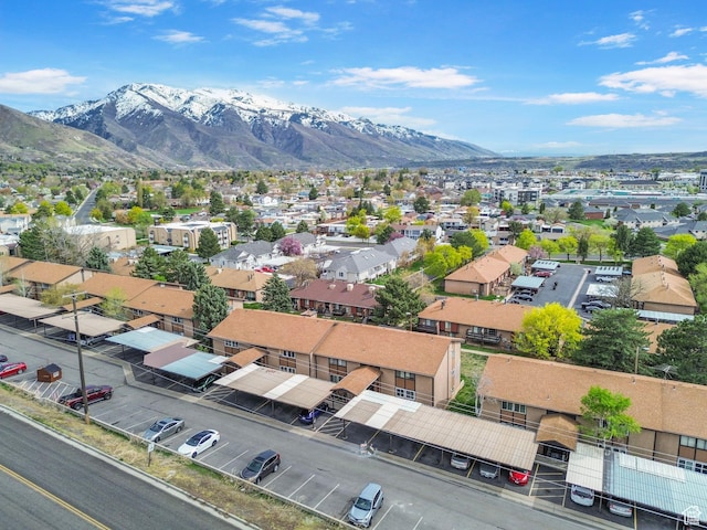 birds eye view of property with a mountain view