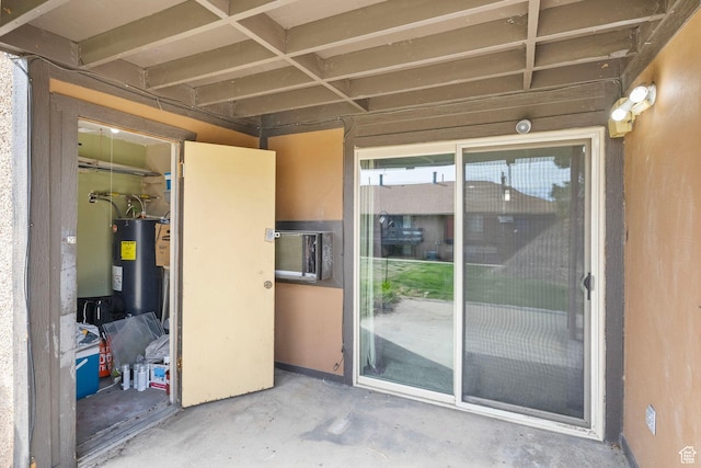 view of exterior entry featuring water heater
