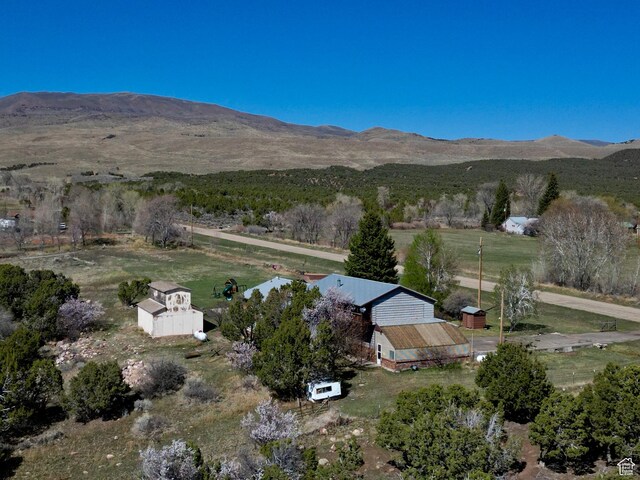 aerial view featuring a mountain view and a rural view