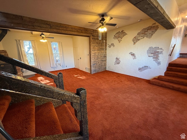 interior space with stairs and ceiling fan