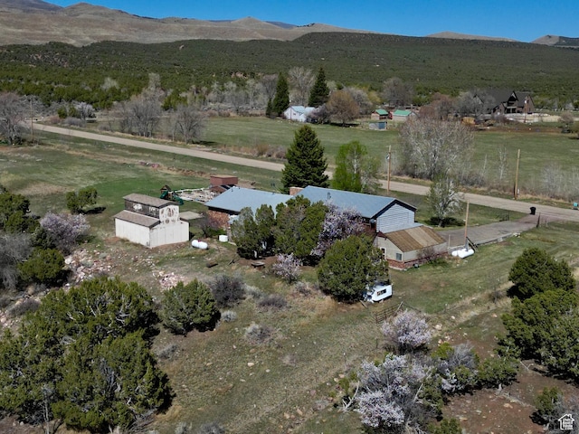 birds eye view of property with a mountain view and a rural view