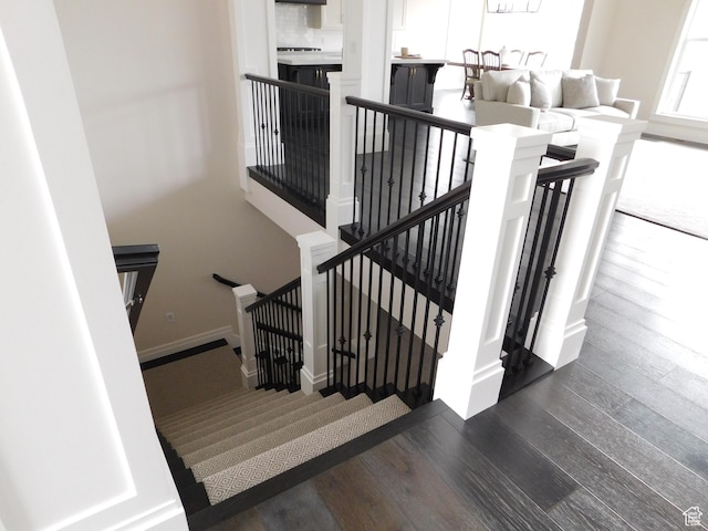 stairway featuring wood finished floors