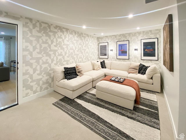 living room with baseboards, carpet flooring, wallpapered walls, and recessed lighting