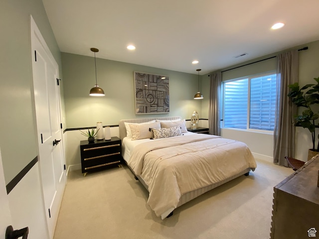 bedroom featuring recessed lighting, visible vents, and light colored carpet