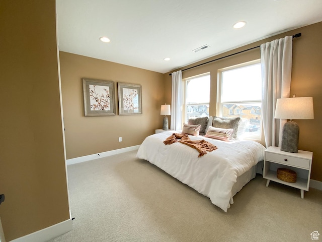bedroom featuring recessed lighting, baseboards, visible vents, and light carpet