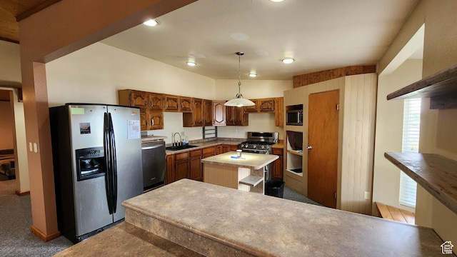 418 S 100 E, Wellington, UT 84542 - kitchen featuring appliances with stainless steel finishes, a center island, carpet floors, decorative light fixtures, and light countertops