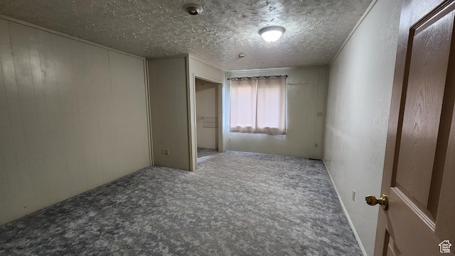 418 S 100 E, Wellington, UT 84542 - carpeted spare room featuring a textured ceiling