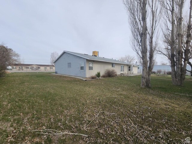 418 S 100 E, Wellington, UT 84542 - view of property exterior with a lawn