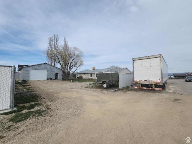 418 S 100 E, Wellington, UT 84542 - view of parking / parking lot featuring a garage