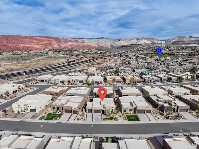 birds eye view of property with a residential view and a mountain view