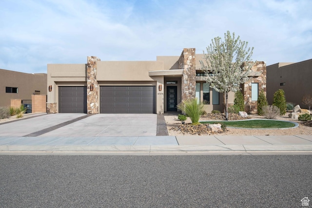 view of front of property featuring stucco siding, an attached garage, stone siding, and concrete driveway