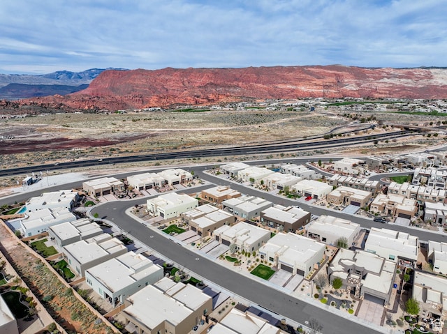 birds eye view of property with a residential view and a mountain view