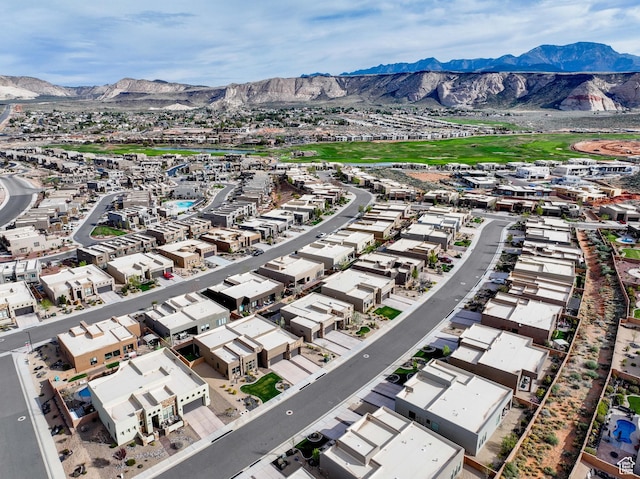 drone / aerial view featuring a residential view and a mountain view