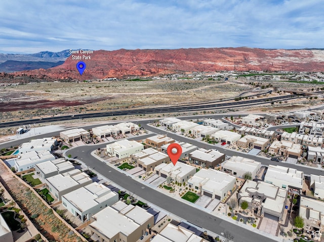 drone / aerial view with a residential view and a mountain view